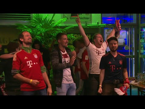 Football/Champions League: Bayern fans celebrate after Kingsley Coman scores | AFP