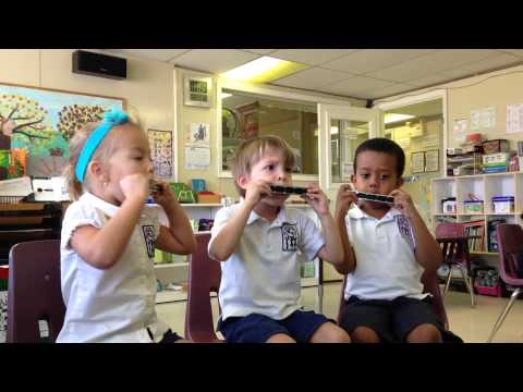 Montessori Children Playing The Harmonica