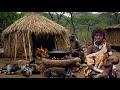 Watch The Hadzabe Tribe S Thrilling Bush Pig Hunt And Mouthwatering Wild Meat Roasting Technique