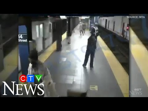Woman survives being pushed in front of NYC subway train
