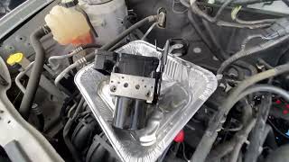 Solved -  ABS light flashing B1342 code EBCM Removal (Ford Escape)