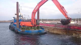 Dredging in harbour. DOOSAN DX 420LC