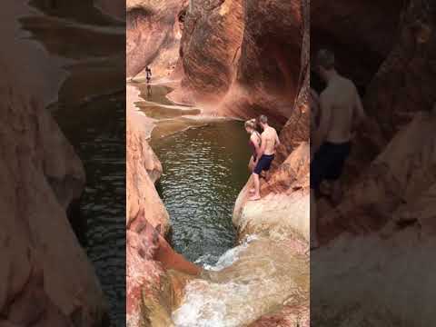 Jumping into Red Cliffs Waterfall