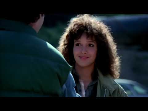 Flashdance trailer frame: final-tryout energy, leaping dancer and judges in silhouette