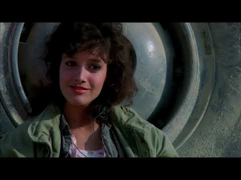 Flashdance 1983 trailer frame: Alex Owens biking at dawn through Pittsburgh