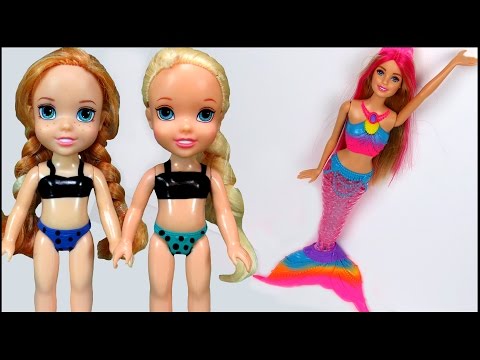 Elsa & Anna toddlers play with Barbie the Mermaid  !