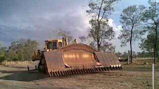 Caterpillar D8N with a 24ft clip on stickrake