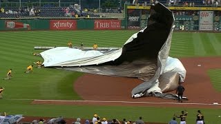 Cutch, Bucs help grounds crew control tarp