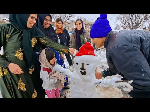 Building a snowman and spending a happy day at Ghodrat's house