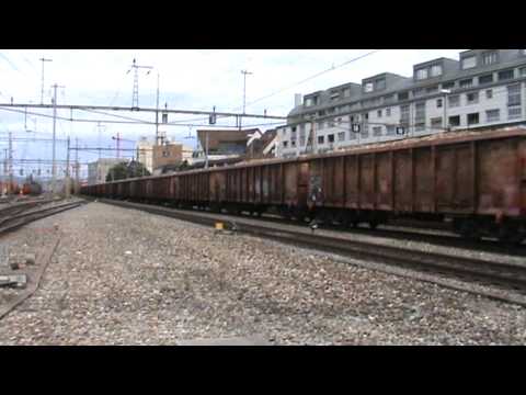 SBB Re 6/6 "11630 Herzogenbuchsee" & Re 4/4 II "11327" roll through Thun with cargo train