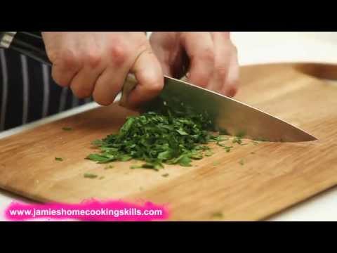 Chopping a bunch of fresh herbs: Jamie’s Food Team