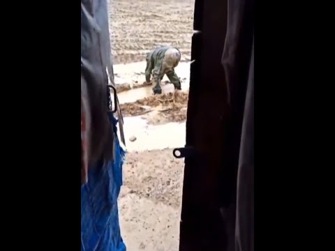 Drunk Russian Soldier Struggles in Mud in Ukraine