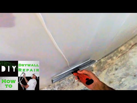 How to skim coat a wall in less then 10 minutes | Diy Drywall Tips and Tricks Video