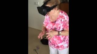 Grandma rides a virtual roller coaster for the first time