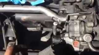 Remove power steering and alternator belts from 90 DSM
