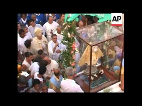 Procession through the streets in honour of Virgen de la Caridad