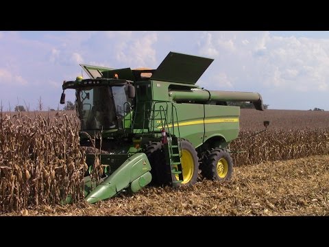 Four John Deere S670 Combines Harvesting Corn