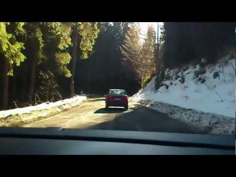 A BMW makes a bad overtake with no visibility..