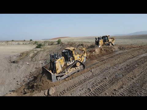 Caterpillar D9T Bulldozers Pushing Soil On Huge Mining Site - Aerial View
