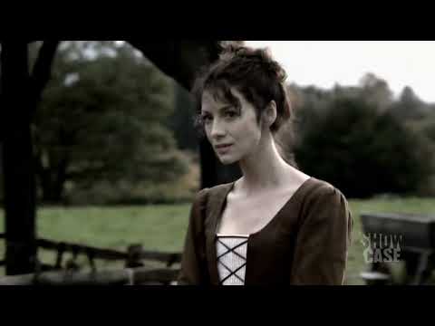 Outlander Season 1 trailer still of Claire and Jamie in the Highlands, signaling the soundtrack’s Celtic palette