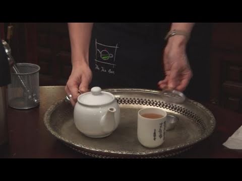 Part of a video titled How To Pour Tea Through A Strainer - YouTube