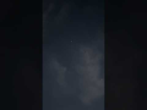 Weird twin orbs joining in the night sky.