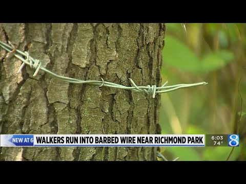 Walkers irked by barbed wire on trail north of Grand Rapids park