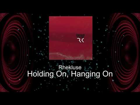 Rhekluse - Holding On, Hanging On