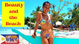 Young Filipina and Old Foreigner enjoying day trip at Lambug Beach, Moalboal, Cebu, Philippines