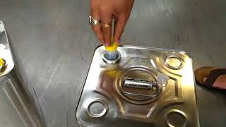 How to open oil tin's lid