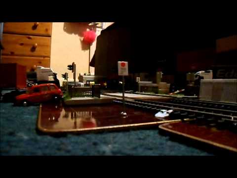 Bachmann Windhoff MPV Master & Slave in Network Rail livery - Thundering through the level crossing.