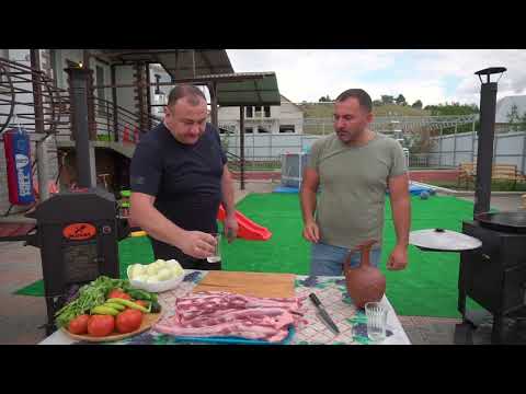 A DISH made of COW'S TAILS. MEAT in a CAULDRON.