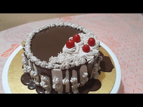 Chocolate Sponge Cake Decoration with Chocolate Ganache and Ever Whipped Cream Frosting.