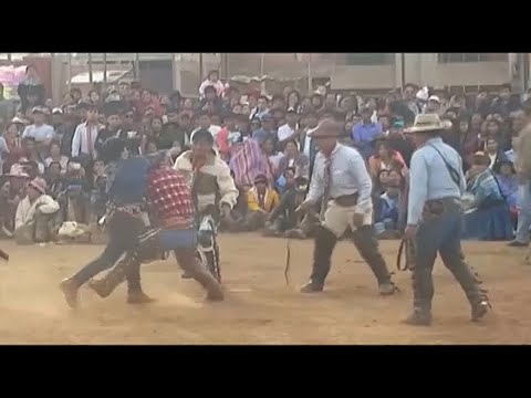 Into the new year without old vices: Fist fighting in Peru is said to have a liberating effect