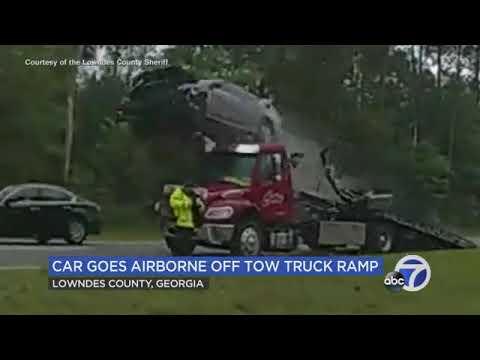 Car flies airborne off back of tow truck in Georgia crash