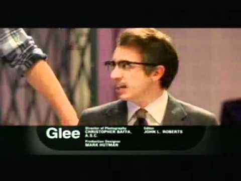 Glee Rocky Horror episode promo frame with stage lights and ensemble in costume