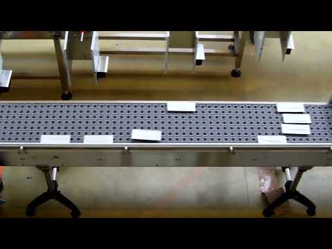 Convergeur à galets orientés en continu sans contact avec le produit à fond plat et rigide_1