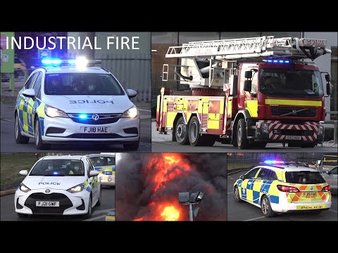 Fire trucks, police cars and emergency vehicles responding to Industrial Fire in Nottingham