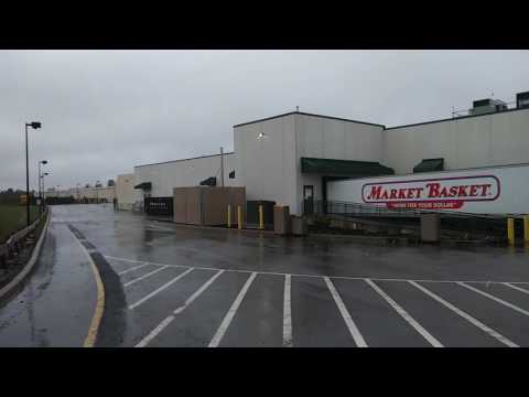 Hudson - Berlin, Mass. At Market Basket. Water tower and surrounding woods