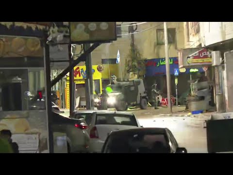 Palestinians carry injured, as clashes erupt ahead of prisoners release | AFP