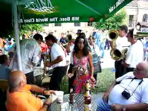Guca 2007 Brass band playing and gypsy girl dancing