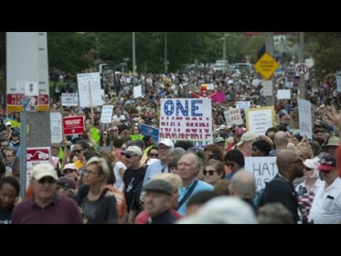 الآلاف يشاركون في مسيرة ضد العنصرية في بوسطن وترامب يشيد بالمتظاهرين