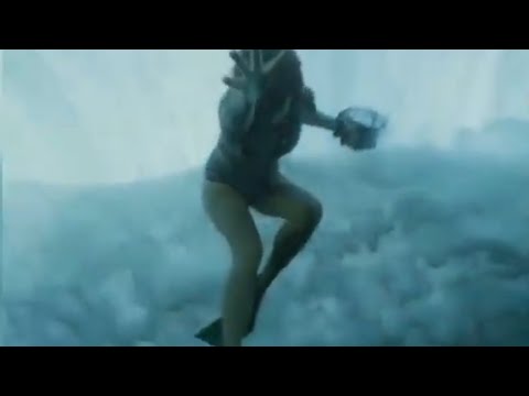 SWIMMING UNDER A WAVE