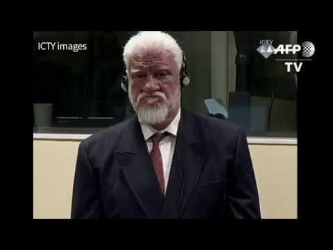 War criminal takes poison in court