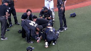 折れたバットが直撃した曽谷、倒れたまま動けず。場内騒然となる。
