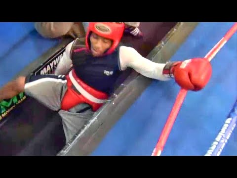 When trash talking goes wrong! Boxer gets knocked out of the ring inside the Mayweather Boxing Club