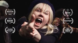 A WOMAN WALKS INTO A BANK (2022)