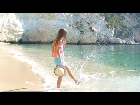 Girl Kicks Water Stock Video