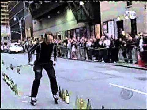 a Skater plays music with bottles