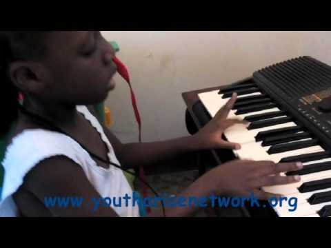 YANU Child playing a piano